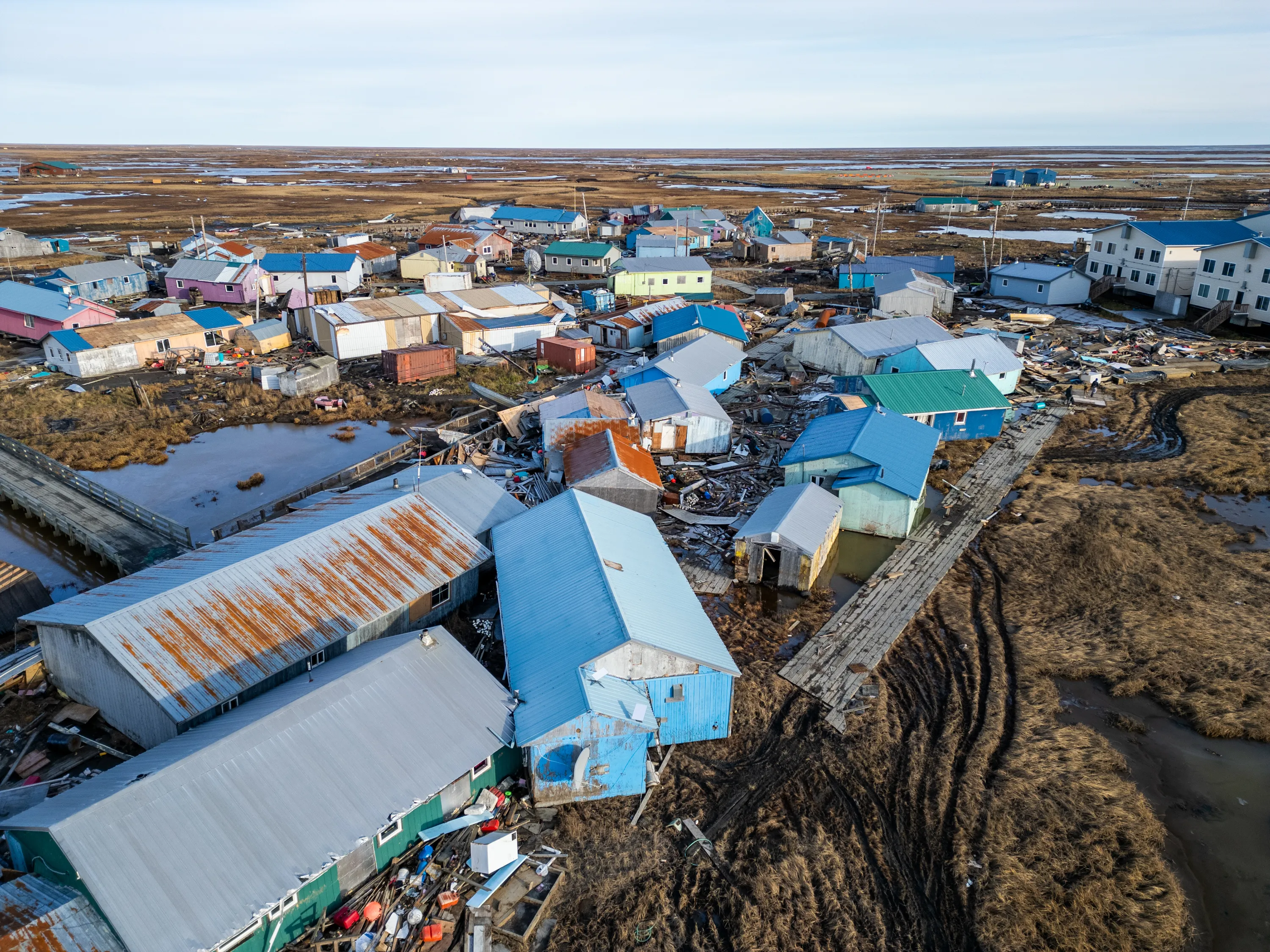 An aerial view of colorful buildings that have collided into one another.